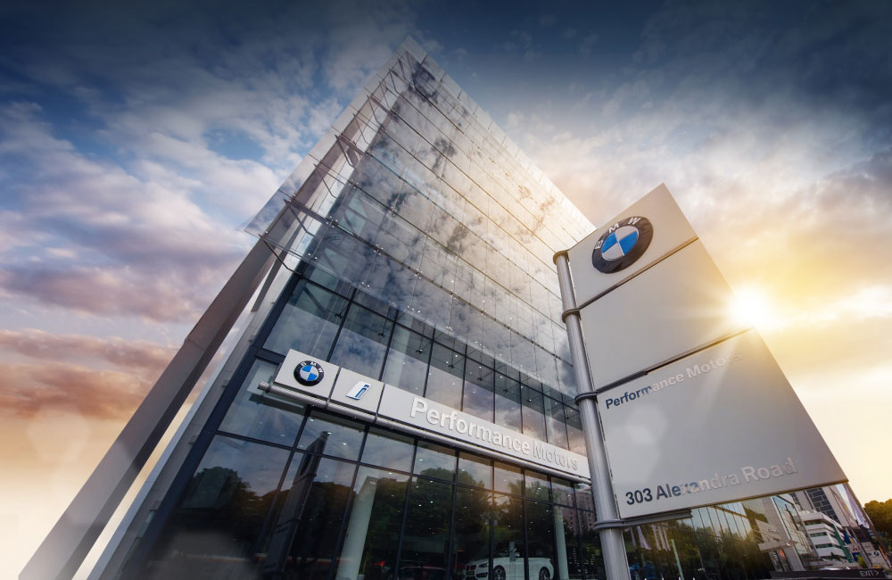 Carefree family that uses BMW Financial Services playing by a stream