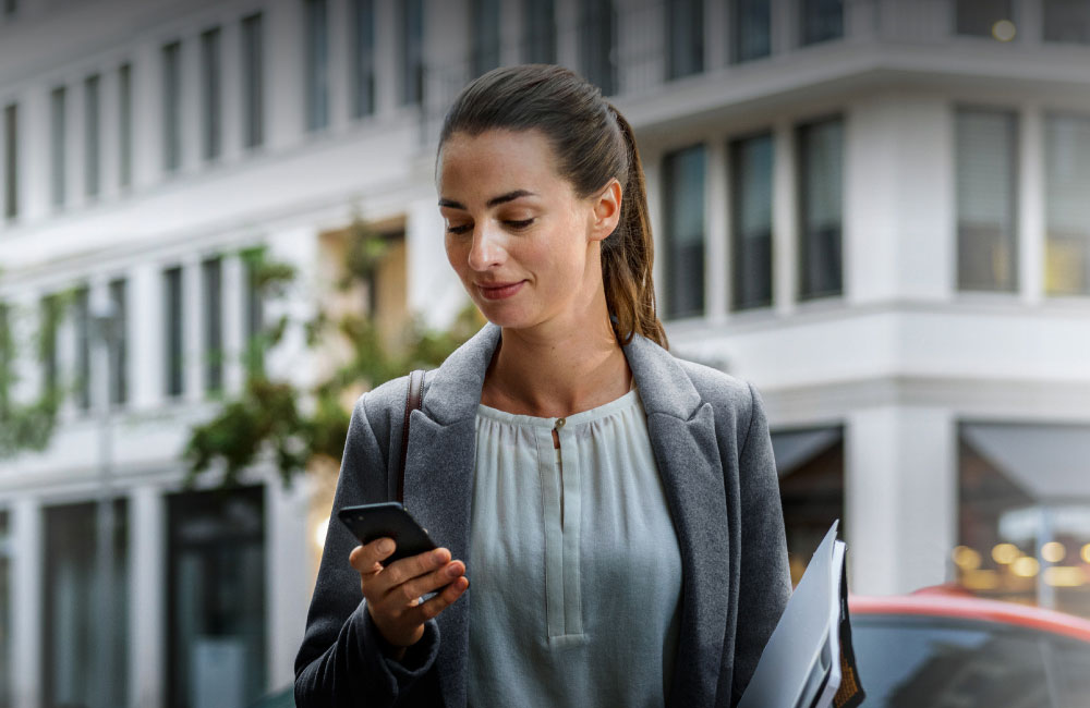 Man browsing BMW Convenience 360 on mobile phone