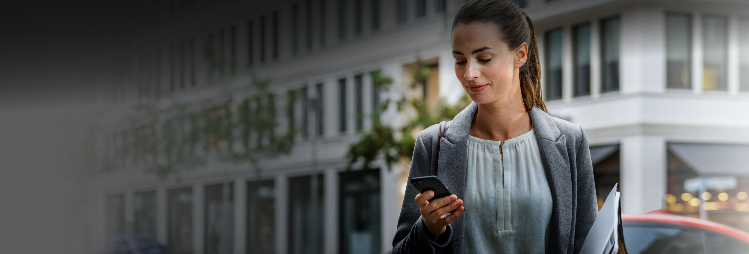 Man browsing BMW Convenience 360 on mobile phone
